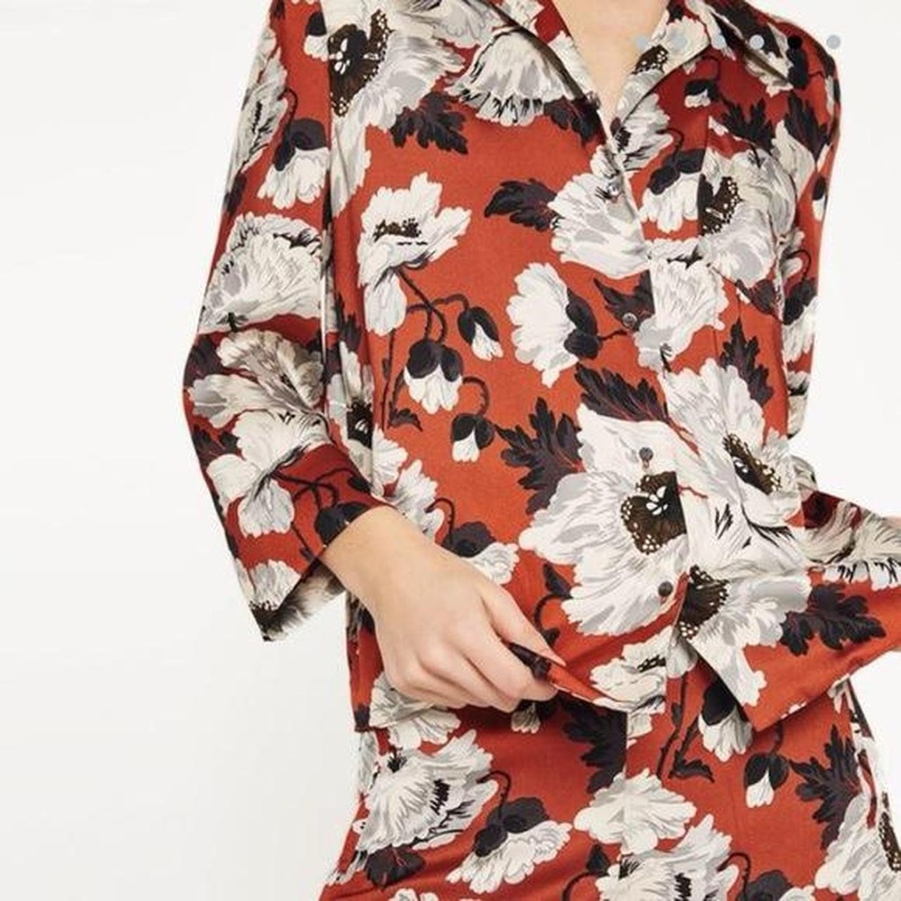 Zara women’s orange and burgundy floral blouse